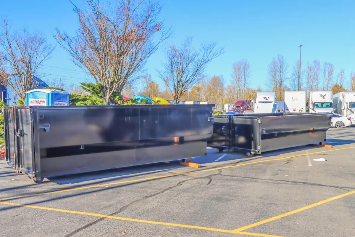 Professional dumpster rental service with roll-off container on residential driveway in Waycross